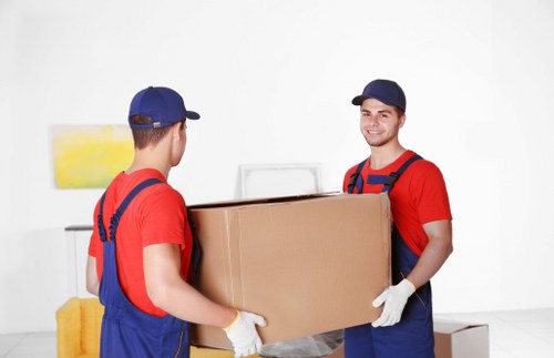 Organized storage unit in Acton with packed boxes and furniture