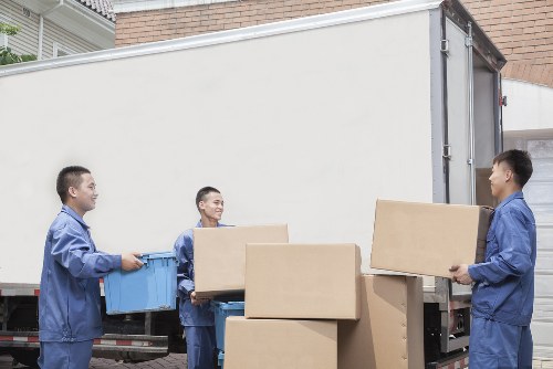 Commercial moving vehicles near Acton office buildings