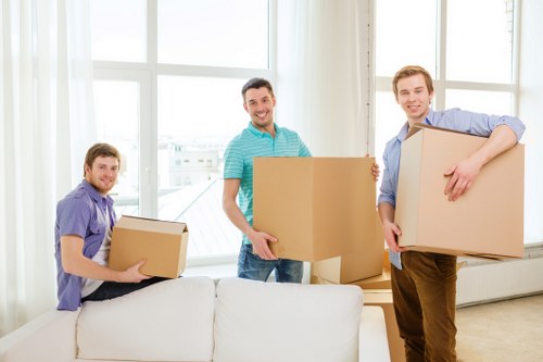 Packed moving boxes ready for removals in Acton