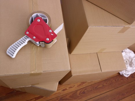 Acton resident packing boxes into a mobile storage container