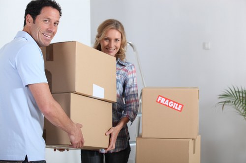 Packed boxes and furniture ready for a small move in Acton